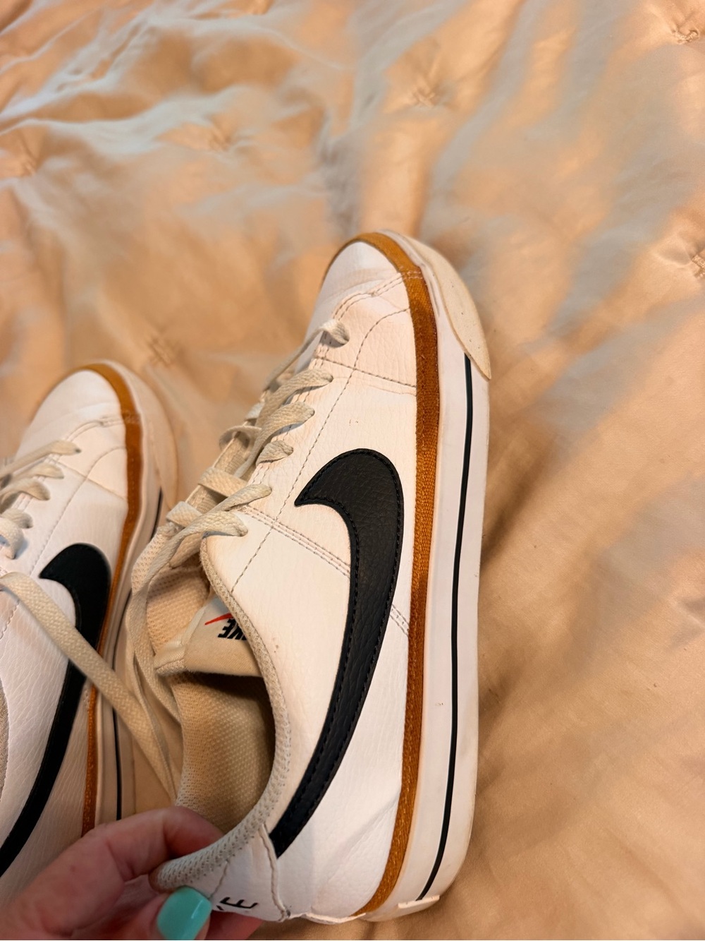 Nike White Leather Sneakers with Black Swoosh and Brown Accent